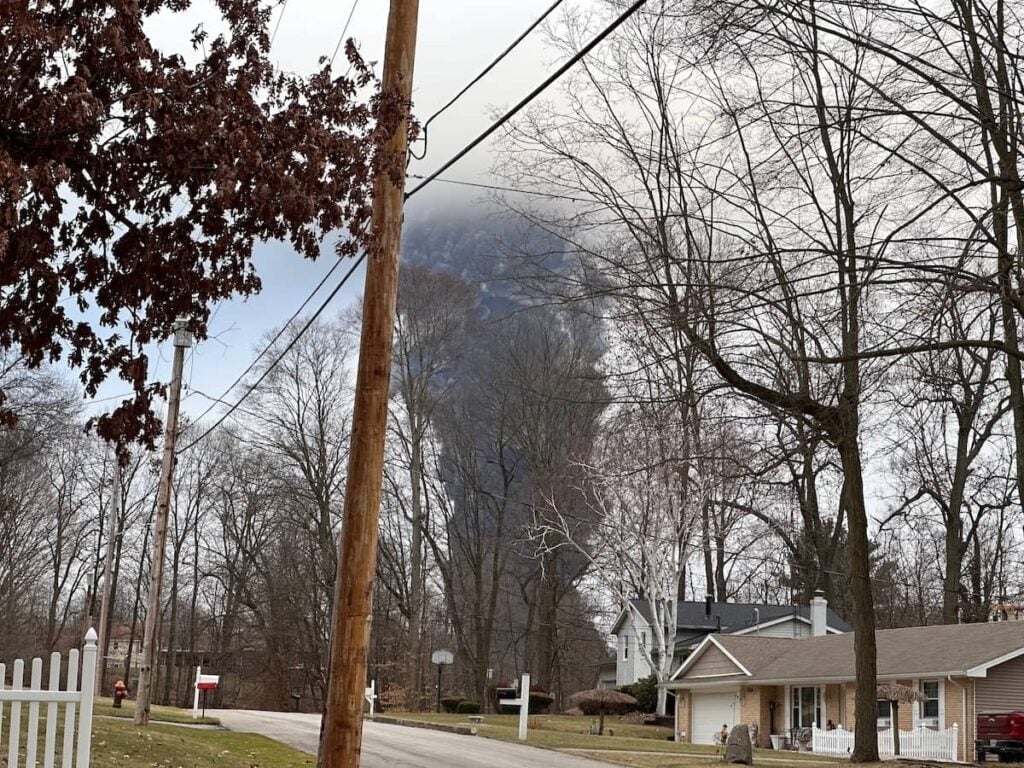 Smoke cloud rising from the site of the East Palestine train derailment after Norfolk Southern's 'chemical burn off' | Burg Simpson Law Firm